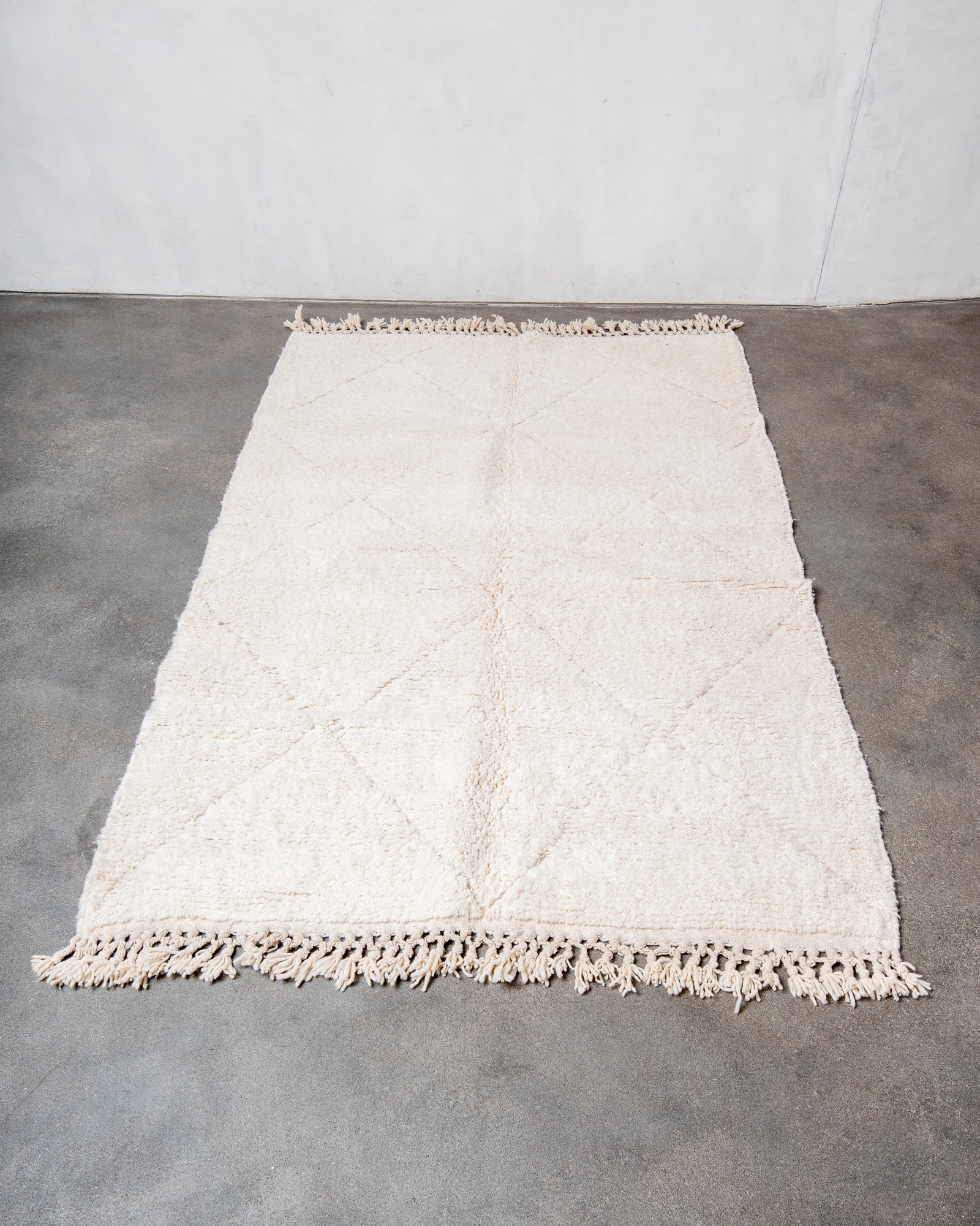 Modern, designer, handcrafted Berber rug from Morocco. Beniourain carpet with beautiful colours and patterns and fluffy wool texture.